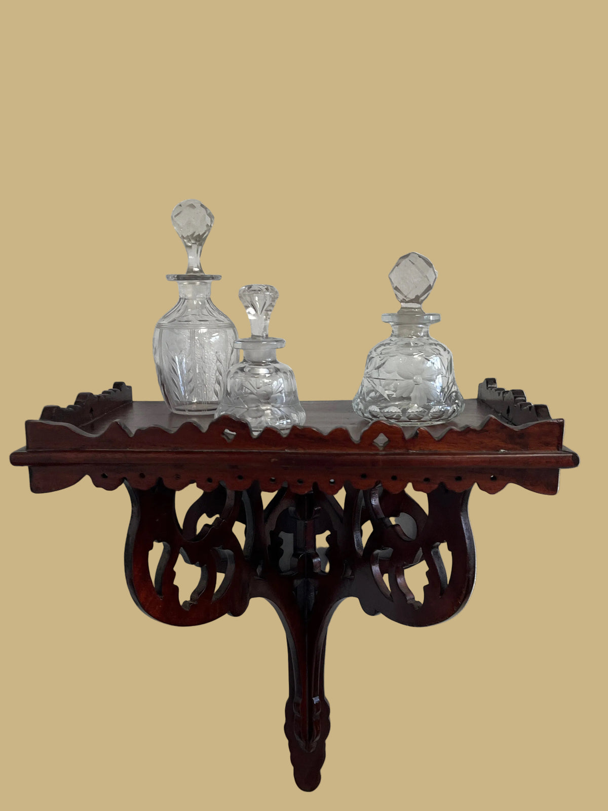 A hand-carved Mahogany wall/clock shelf