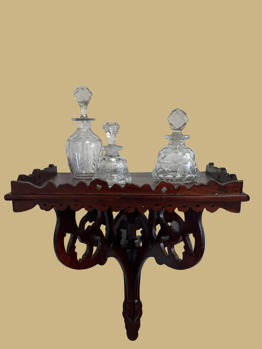 A hand-carved Mahogany wall/clock shelf
