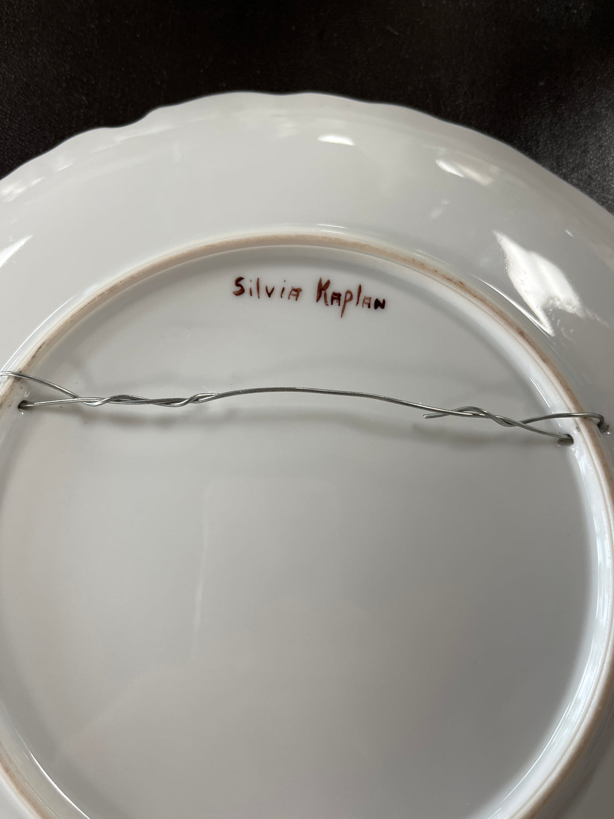 Artist-signed porcelain plate by Silvia Kaplan